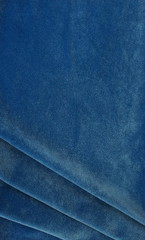 velvet texture classic blue color background, expensive luxury fabric,  wallpaper. copy space