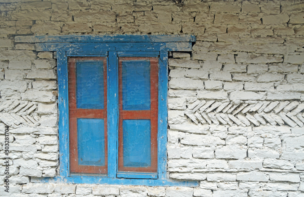 Wall mural blue pastel window on the white stone house wall - texture background