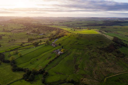 Stunning aerial drone landscape image of Peak District countryside at sunrise on Autumn Fall morning