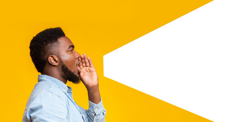 Guy making loud announcement at copy space on yellow background - obrazy, fototapety, plakaty
