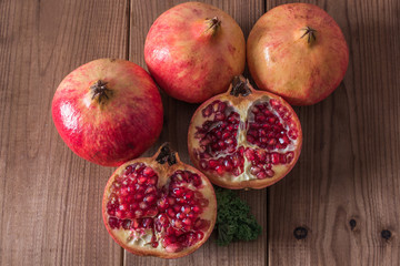 natural pomegranate on rustic wooden background