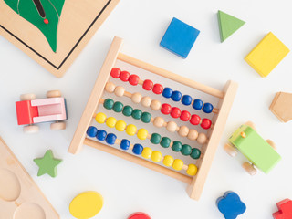 kids learning concept with stacking toys on white table background.