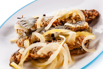 Marinated herrings on white background