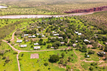 Oblique aerial view of  the abandoned indigenous community "Oombulguri," formerly Forrest River Mission, near Wyndham in Cambridge Gulf in the Kimberley region of Western Australia.