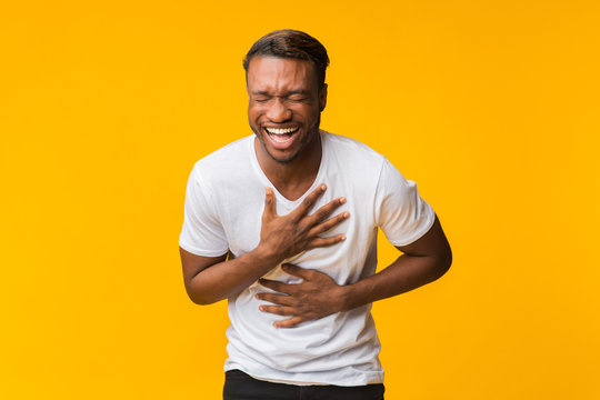 Black Man Standing Laughing Out Loud, Studio Shot