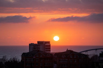 Landscape with sunset view over sea and city