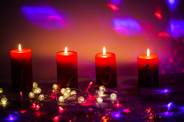 Obraz na płótnie Canvas Candles for Advent with fairy lights