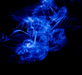 Blue smoke on black background