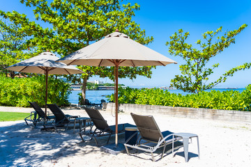 Umbrella and chair on the beach and sea with blue sky