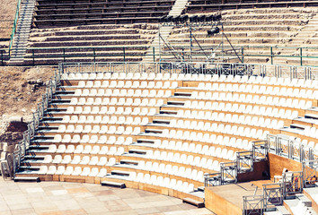 Seats in antique amphitheater Teatro Greco in Taormina, Sicily, Italy.