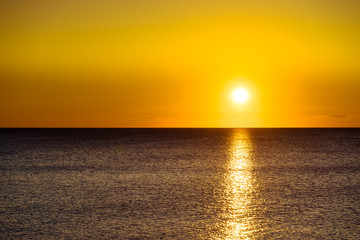 Sunset or sunrise over sea surface