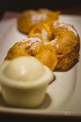 Fresh Bavarian Apple Pie In Beer Batter, with Vanilla Ice Cream and Fresh Mint on a white china plate