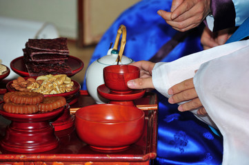A table with wine and some side dishes 