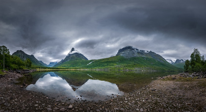 Great view of Innerdalen mountains and lake dark weather panorama
