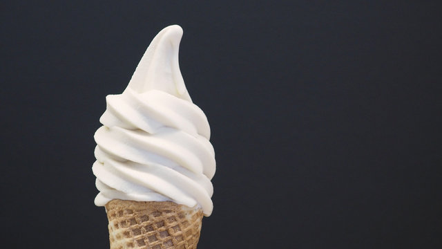 Soft Serve Ice Cream Cone On Black Background. (close Up )