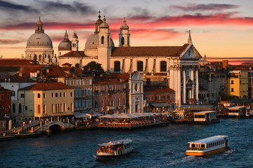 Venice skyline at sunset. Historical buildings and boats  in canal. Venice. Italy.