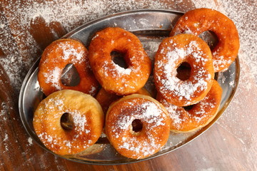 Freshly fried donuts. Making Doughnuts.