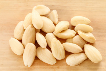 Almond nuts on a wooden background.