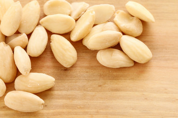 Almond nuts on a wooden background.