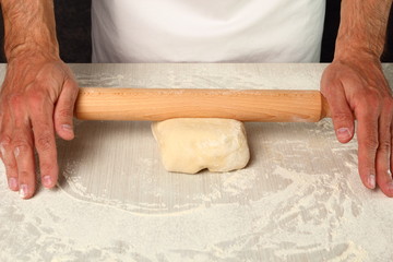 Making Puff Pastry. Rolling dough to rectangle.