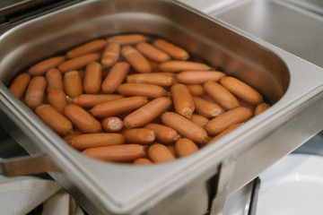 Sausages in bowl at the buffet table