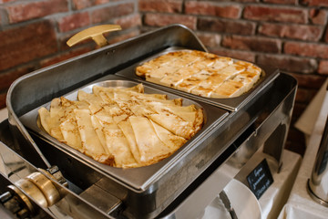 Cheese cake and pancake in bowl on the buffet table