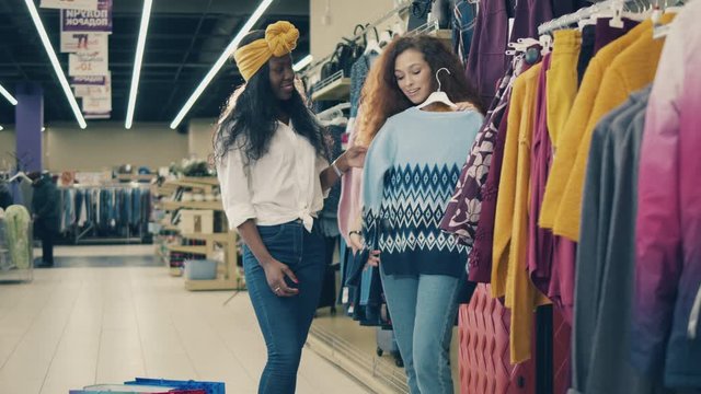 Clothes shopping of two young women