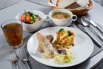 Meat dish with potatoes on table at the restaurant
