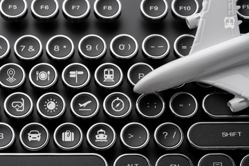 Travel icon on computer keyboard for online booking concept