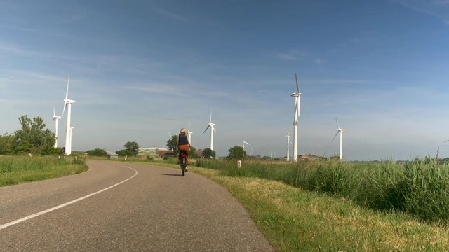 Cycling on a bike path through a wind farm.