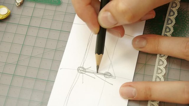 architect draws a project on a white sheet