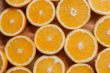 Healthy food, background. Orange slices as background texture. sliced fresh oranges arranged in shape on wooden background