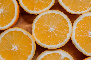 Healthy food, background. Orange slices as background texture. sliced fresh oranges arranged in...