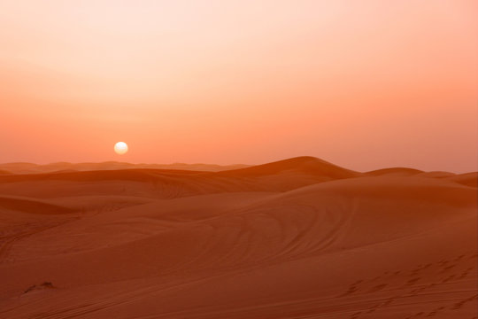 Sand desert sunset landscape view, picturesque landscape with sun, UAE. © Travel Faery