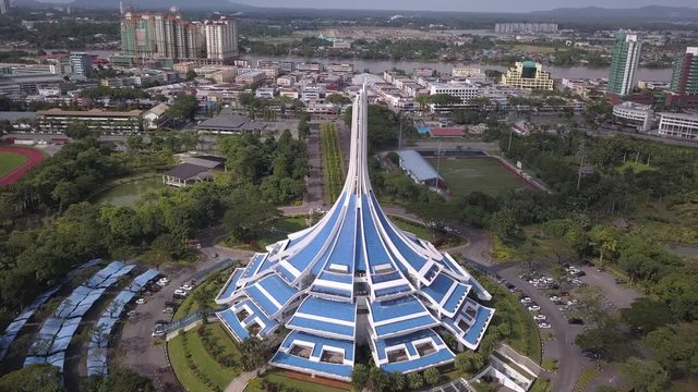 Kuching, Sarawak / Malaysia - November 17 2019: The iconic MBKS building and its surrounding lake, scenery, and gardens
