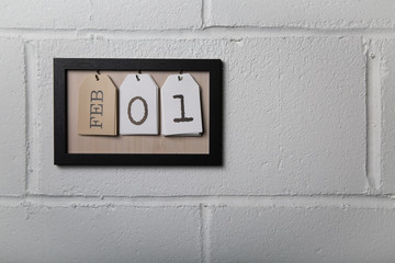 Wall Hanging Calendar in a Picture Frame Showing February 1