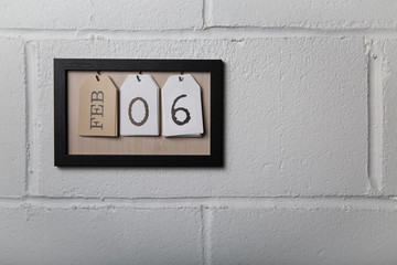 Wall Hanging Calendar in a Picture Frame Showing February 6