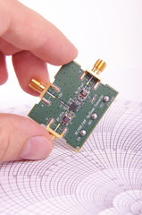 RF engineer inspect microwave mixer PCB - obrazy, fototapety, plakaty