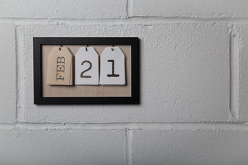 Wall Hanging Calendar in a Picture Frame Showing February 21