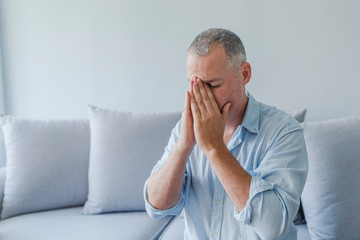 Man suffering from headache, vertigo, hangover, migraine, stress