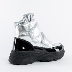women winter silver boots made of soft patent leather with Velcro fastener on a white background