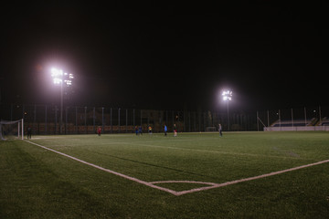 Fototapeta na wymiar Photo of a soccer stadium at night