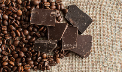 Chocolate and coffee beans on a textile background