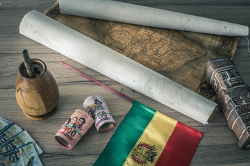 Bolivia.  Country flag on the background of the old map and things associated with Bolivia