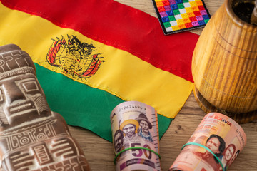 Bolivia.  Country flag on the background of the old map and things associated with Bolivia