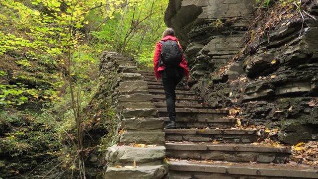 Female Tourist Walking Up Stairs At Watkins Glen State Park Natural Gorge