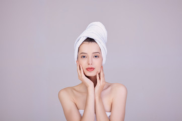 Image of an adorable half-naked woman wrapped in a towel.