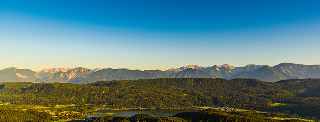 Lake and mountains at Worthersee Karnten Austria. View from Pyramidenkogel tower on lake and Klagenfurt the area.