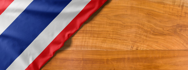 National flag of Thailand on a wooden background with copy space