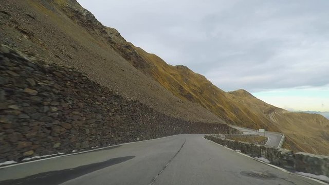 Stelvio - Stilfser Joch serpentine road time lapse drive downhill in autumn